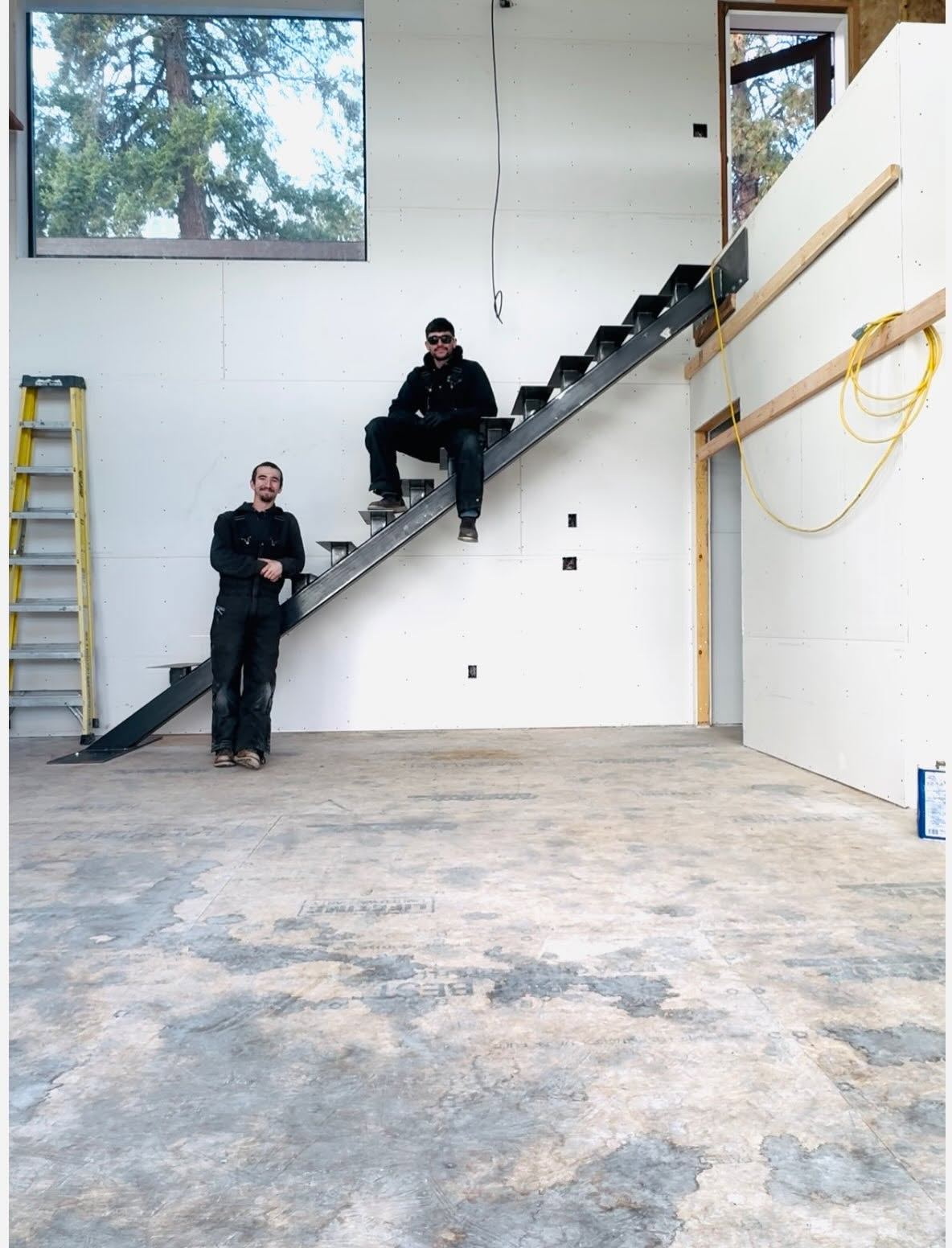 The crew on the finished steel stair